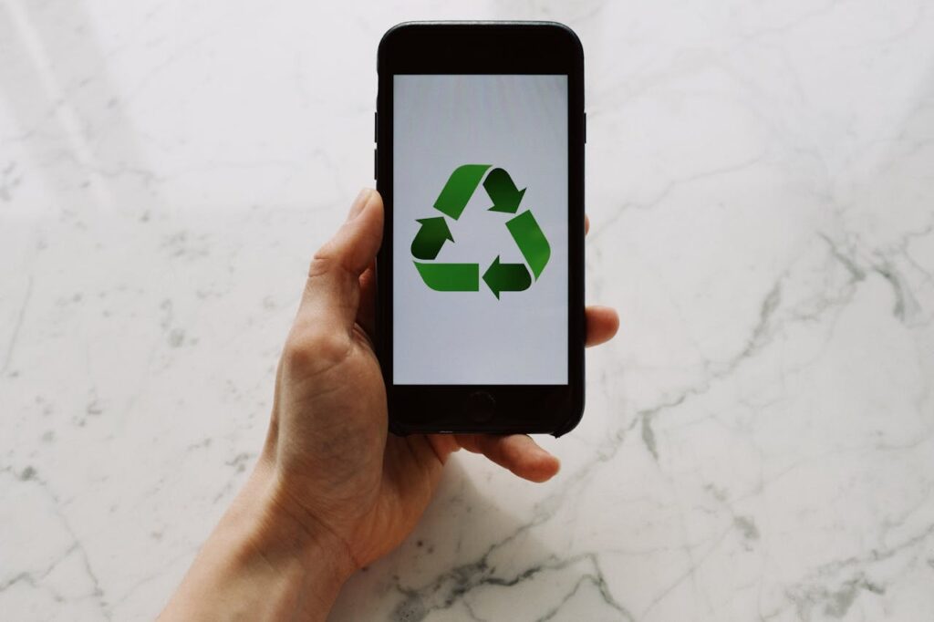 Photo by ready made: https://www.pexels.com/photo/anonymous-person-showing-recycle-symbol-on-smartphone-3850542/