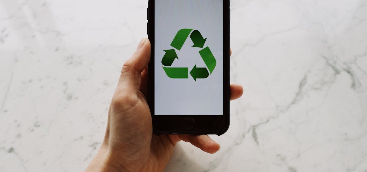 Photo by ready made: https://www.pexels.com/photo/anonymous-person-showing-recycle-symbol-on-smartphone-3850542/